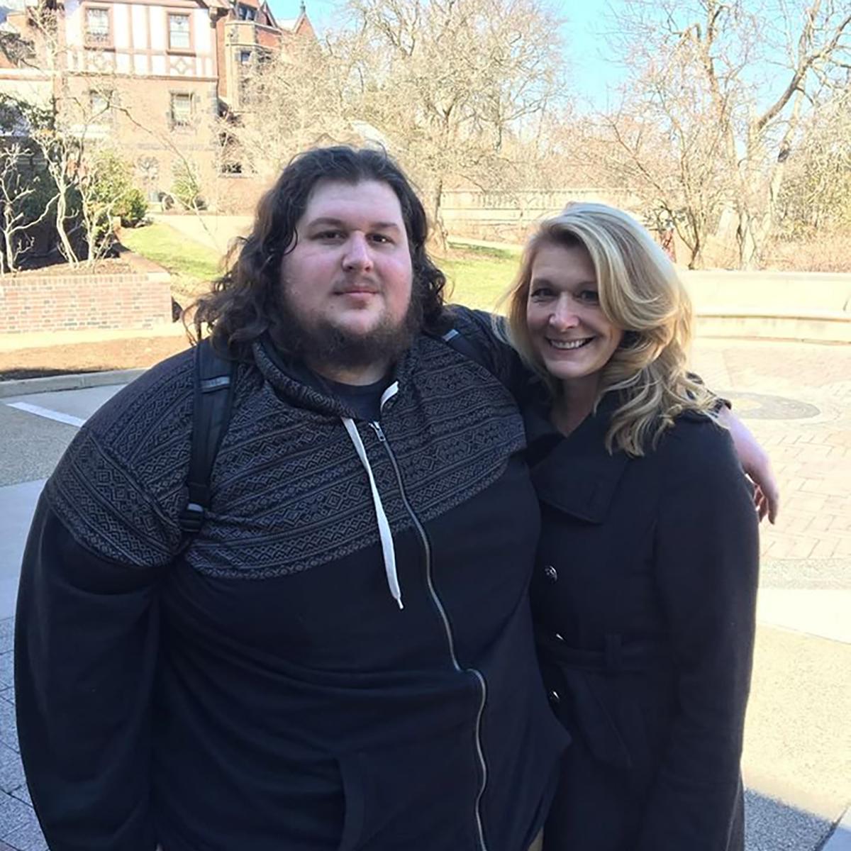 Photo of Christopher posing with a woman on 足球波胆平台