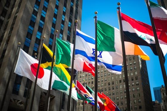 Photo of international flags waving in the breeze outside of the U.N.