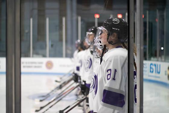 Photo of Chatham's women's hockey team in uniform on the ice, all in a line